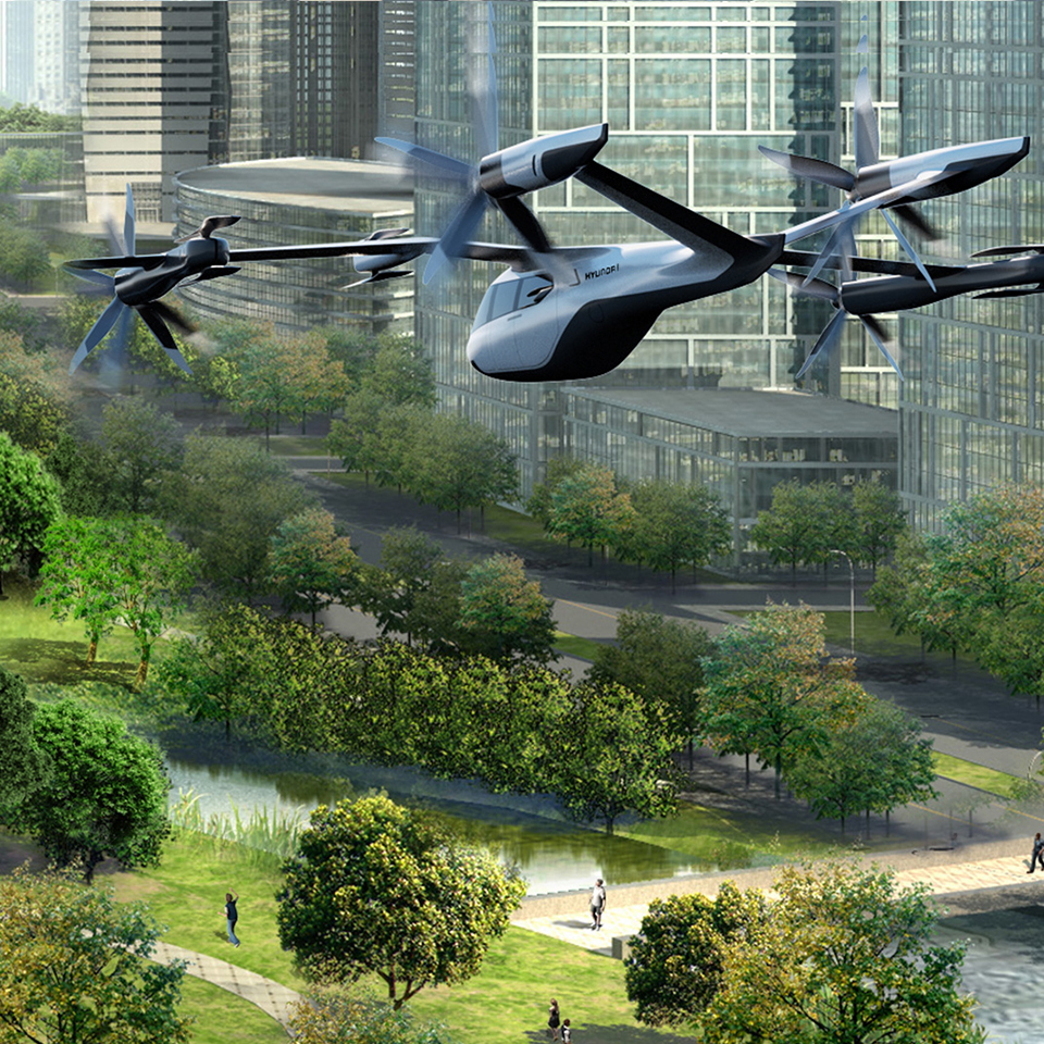 UAM이 비행하고 있는 미래 모빌리티 도시의 조감도