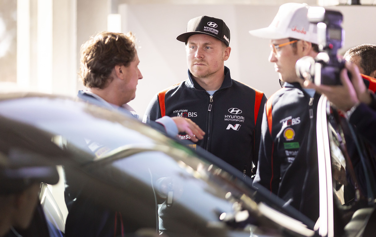 Drivers Talking In Front Of Rally 1 Machine